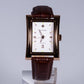 Reloj de pulsera de acero inoxidable chapado en oro con correa de cuero marrón
