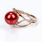Anillo de Plata Bañada en Oro con Perla roja de río y Topacio Blanco