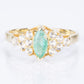 Anillo de Plata Bañada en Oro con Esmeralda de Brasil y Topacio Blanco