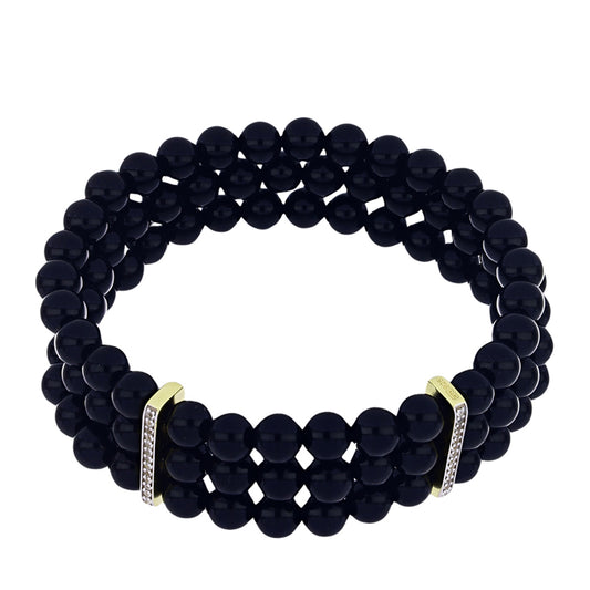Pulsera de Plata Bañada en Oro con Ónix negro de Suwar y Topacio Blanco